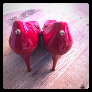 Stuart Weitzman size 8 red peep toe pump.